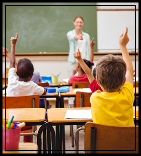 students with hands raised